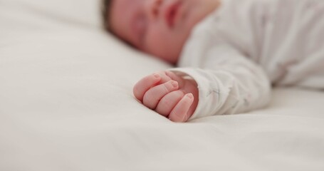 Poster - Hand, newborn and sleeping on bed in nursery with relaxing, resting and nap on blanket in morning. Baby, peaceful and dreaming in bedroom of home for child development, growth and nurture or relax