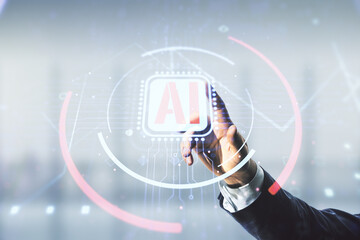 Poster - Double exposure of businessman hand working with creative artificial Intelligence abbreviation hologram on blurred office background. Future technology and AI concept