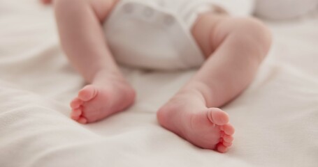 Sticker - Sleeping, adorable and feet of baby on bed for child care, dreaming and relax in nursery. Family, cute and closeup of toes of innocent newborn infant for health, wellness and development at home