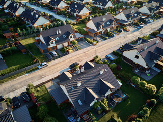 Wall Mural - Aerial view of family houses in suburban neighborhood, Residential buildings in small town, Real estate in Poland with townhouses