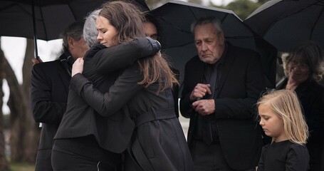 Funeral, crying family and people hug for grief support, mourning depression and death at emotional burial event. Kid child, mom and group together with widow hugging senior mother at coffin ceremony