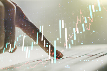 Poster - Multi exposure of abstract financial graph with hand typing on laptop on background, financial and trading concept