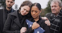 Funeral, Death And Support For A Woman With A Flag At A Cemetery In Mourning At A Memorial Service. Sad, Usa And An Army Wife As A Widow In A Graveyard Feeling The Pain Of Loss Or Grief With A Friend