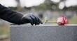 © Nina Lawrenson/peopleimages.com - Funeral, cemetery and person with rose on tombstone for remembrance, ceremony and memorial service. Depression, sadness and hands with flower on gravestone for mourning, grief and loss in graveyard