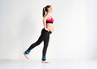 © Dasha Petrenko - One young pregnant woman doing fitness exercises