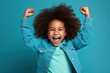 © wolfhound911 - African American little girl dressed stylish clothes celebrate success raise hands fists isolated on dark blue color background