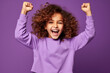 © wolfhound911 - Photo of overjoyed cheerful girl dressed stylish clothes celebrate success raise hands fists isolated on purple color background