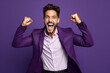 © wolfhound911 - Cheerful man dressed stylish clothes celebrate success raise hands fists isolated on purple color background