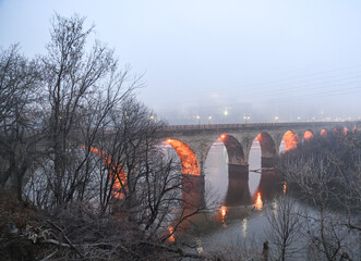 Wall Mural - Old stone arch bridge across the Mississippi river 