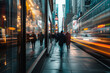 © wedninth - Blurry image capturing a group of people in motion on a city sidewalk during the early morning hours.