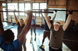 © Davor - Diverse senior people working out with trainer in gym