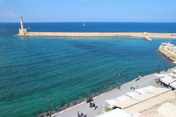 Wall Mural - lighthouse, venitian port and mediterranean sea in chania in crete in greece