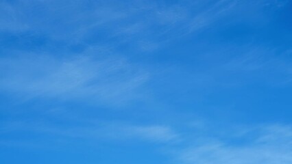 Wall Mural - Blue sky background with tiny clouds, nature cloud blue sky background, time lapse.