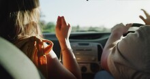 Couple, car and woman dance on road trip, street journey or travel for fun adventure, freedom or tour of Portugal. Auto vehicle, energy and back of people listening to song, radio or streaming music