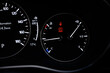 © Kitsada - Detail with the fuel gauges and engine temperature showing and tank on full a bucket dashboard of car.