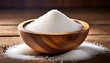 white sugar in a wooden bowl