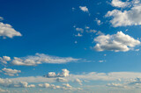 Fototapeta Niebo - White fluffy clouds on blue sky.
