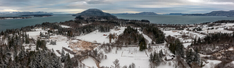 Wall Mural - Aerial view of snowfall on Lummi Island in the Salish Sea area of Washington state. Although infrequent, snow can make for a beautiful landscape on this island in the San Juan Island archipelago.