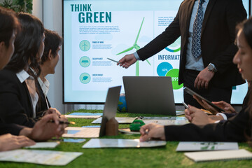 Wall Mural - Businessman leader give presentation on eco-friendly implementation in order to reduce CO2 emission and make sustainable ecology for greener future with renewable alternative energy technology. Quaint