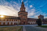 Fototapeta Psy - Morning scene of Sforzesco Castle in Milan