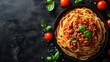 © Flowal93 - Top down view of a plate with italian spaghetti bolognese on a dark black stone texture background with space for text for designer