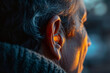 Old white woman with hearing aid, futuristic concept