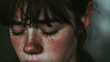 A tearful woman's delicate eyelashes frame her anguished face, highlighting the raw emotion etched into her skin and accentuating the vulnerability of her human form
