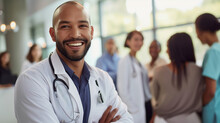  Portrait of doctor consulting with a diverse group of patients in a modern clinic with medical staff in the background