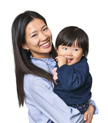 happy chinese mother hugging her child