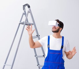 Wall Mural - Man with VR glasses gluing wallpaper