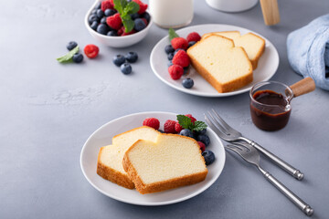 Wall Mural - Traditional pound cake sliced on a plate served with berries