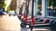 Closeup of a group of electric scooters lined up neatly in a parking lot, showcasing the convenience and sustainability of this mode of transportation.