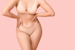 © Pixel-Shot - Body positive woman in underwear on pink background, closeup