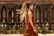 © zolotareva_elina - beautiful young woman in elegant dress at asian temple