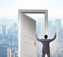 Wall Mural - Businessman standing in front of door into future