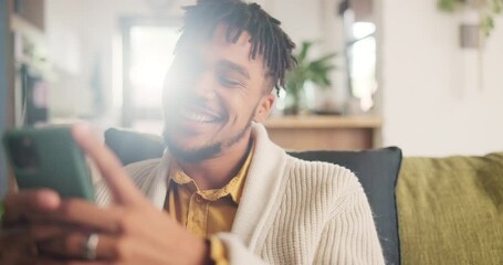 smile, phone and young man networking on social media, mobile app or the internet on sofa at home. h