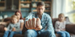 Anger abuse and domestic violence concept. Man threatening wife and kids with his fist. Scared mother and child sitting together on couch in scare. Selective Focus on male hand
