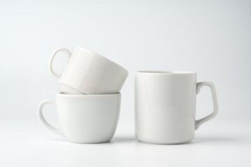 Wall Mural - Blank white mugs mock up on white background