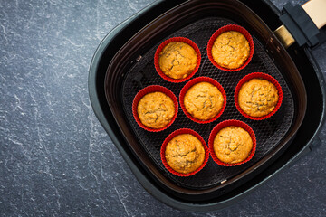 Wall Mural - Cooking and baking in airfryer - homemade apple muffins