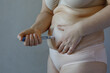 Woman making Semaglutide Injection closeup. Semaglutide or insulin Injection pen in female belly. Semaglutide Diabetes Drug Being Used For Weight Loss.