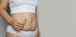 Female body closeup with Semaglutide Injection pen or insulin cartridge pen. Medical equipment for diabetes patient. Diabetes and weight loss concept.