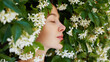 Profile beauty outdoor portrait of young woman in white blooming flower. Spring perfume.