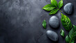 © standret - Top view of spa stones and leaves on dark background. spa therapy. Elegant and luxury spa