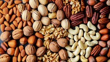 Background With Different Varieties Of Nuts. Top View Of Various Nuts