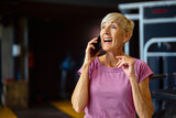 Fototapeta Łazienka - gym sport fitness exercise woman training phone message texting smartphone mobile mobile phone health healthy smart using app online break running treadmill