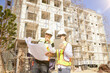 © ฺฺฺBoonterm - Male and female architects caucasian oversee construction new condominium civil engineers inspect blueprints advise planning residential projects real estate luxury and environmentally friendly.