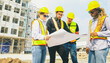 © ฺฺฺBoonterm - Team architects multi ethnic workers men and women meeting brainstorming construction of condominium buildings civil engineers examining blueprints giving advice planning projects housing real estate.