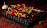 Fototapeta Dmuchawce - a piece of delicious fried meat with vegetables on a board