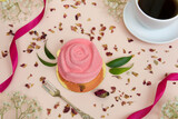 Fototapeta  - Różany deser z kawą na jasno różowym tle. W otoczeniu płatków z róży. 