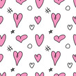 Seamless abstract pattern of different pink hearts and doodles. Freehand scribble background, texture for textile, wrapping paper, Valentines day, romantic design